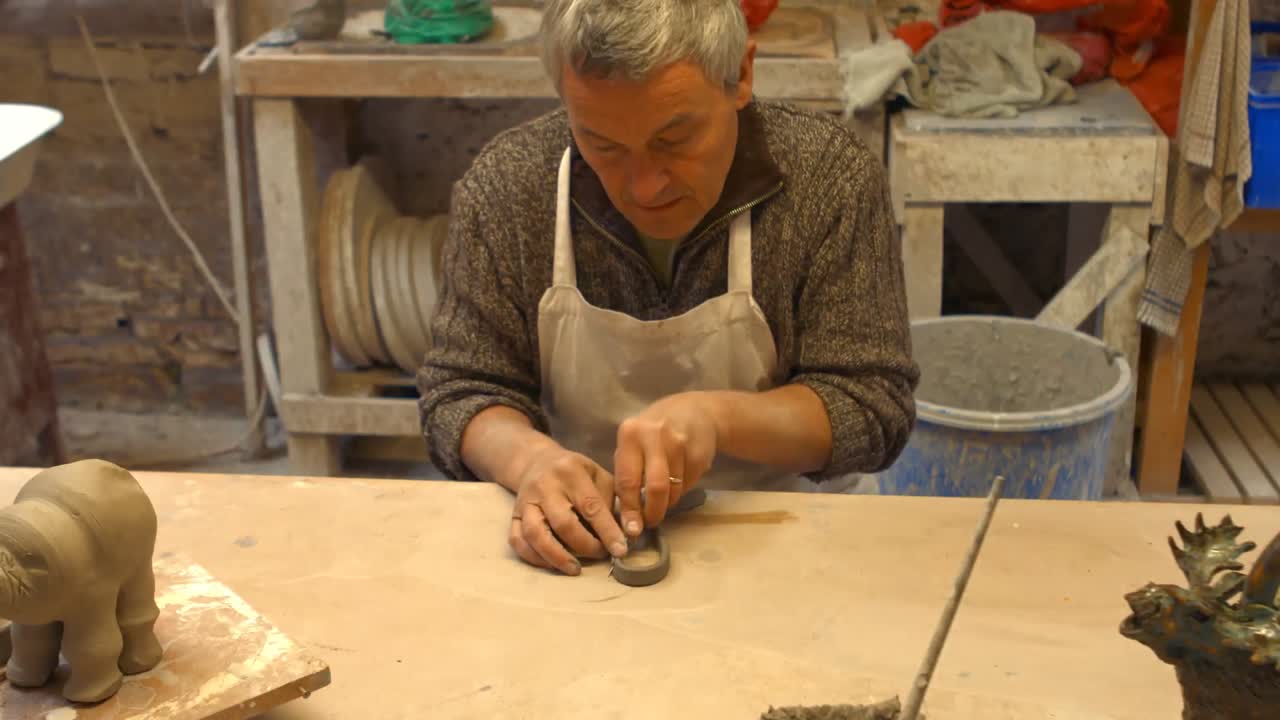 Potter working on pottery shop