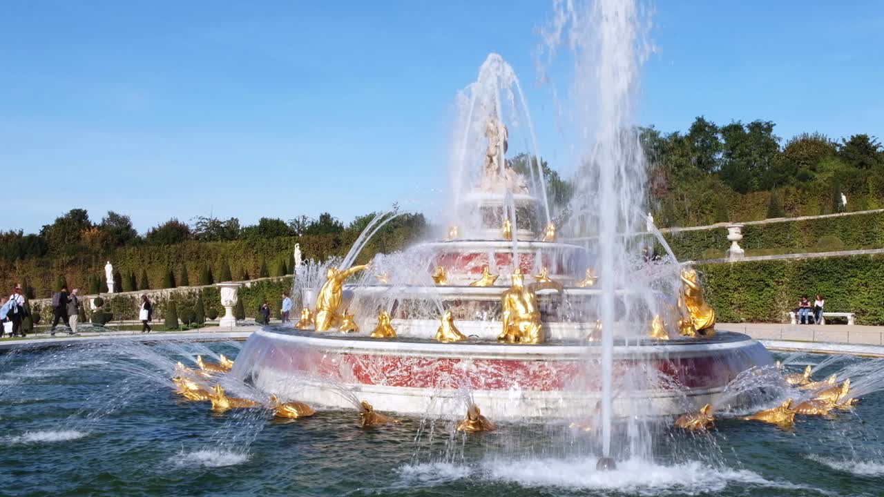 Versailles, France - April 21, 2021: View of a water fountain in the Park of Versailles