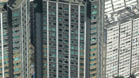 high rise building apartment exterior during the day high angle close up