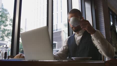 young professional man in a cafe