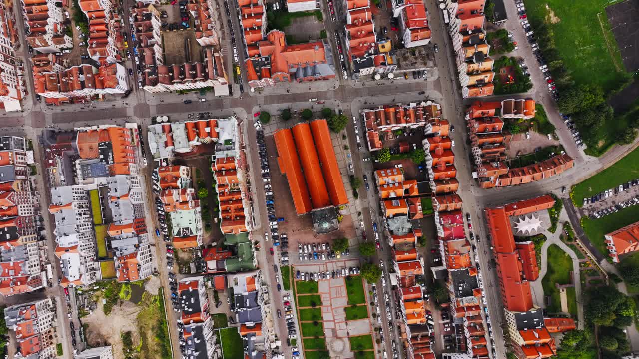 Drone rotates above Elblag Old Town, cathedral, rooftops and historic layout