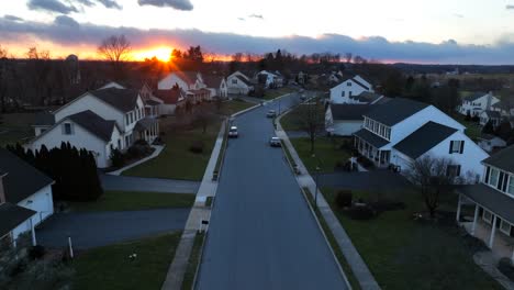 aerial shot of golden sunset over upscale housing neighborhood in america