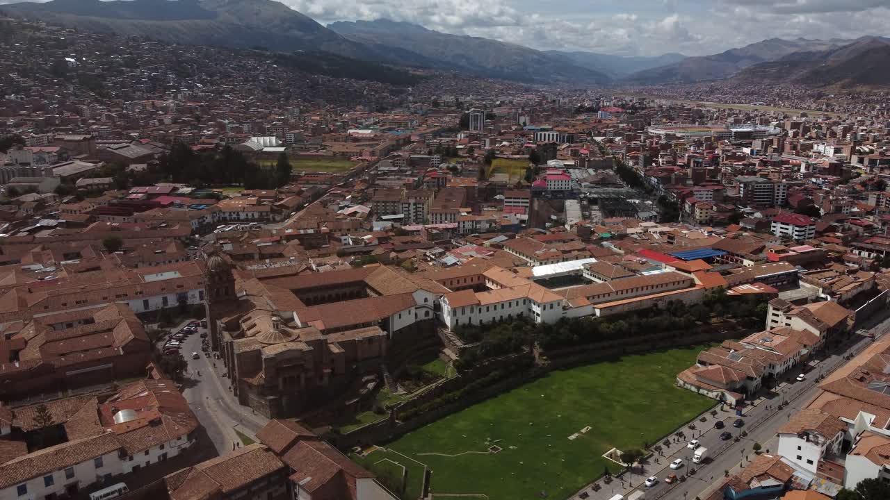 Aerial View of Cusco Cityscape with Historic Buildings and Mountains