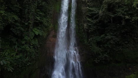 the beautiful gitgit waterfall surrounded by balinese jungle, aerial
