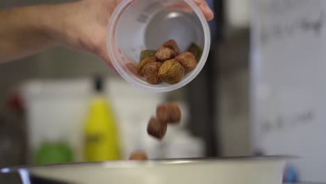 Bowls-of-dog-chucks-being-prepared-in-slow-motion