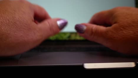 Close-up-first-person-view-of-hands-typing-on-a-laptop-keyboard