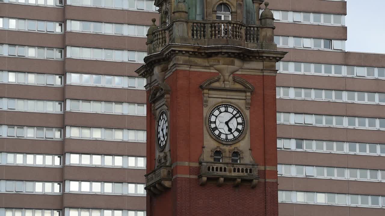 Close-up view of the historic Victoria Station Clock Tower, a historical landmark on Victoria Street in Nottingham, England, showcasing its architectural detail
