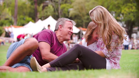 a girl running to her parents at an outdoor event