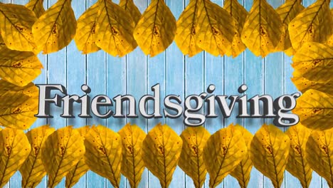 animation of friendsgiving text over orange autumn leaves on blue background