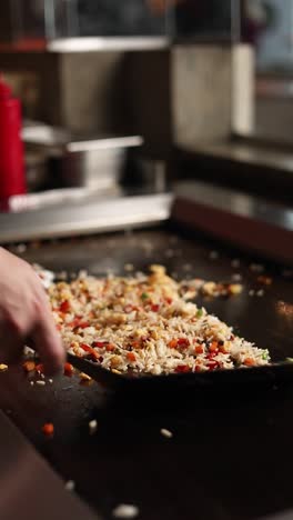 chef preparing delicious fried rice