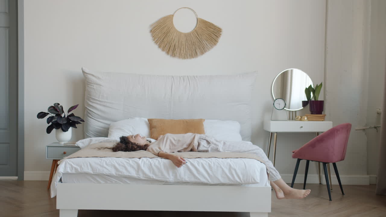 Woman in her bedroom, morning routine