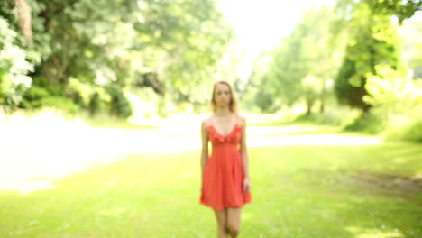 Beautiful-teen-walking-towards-camera-on-a-sunny-day