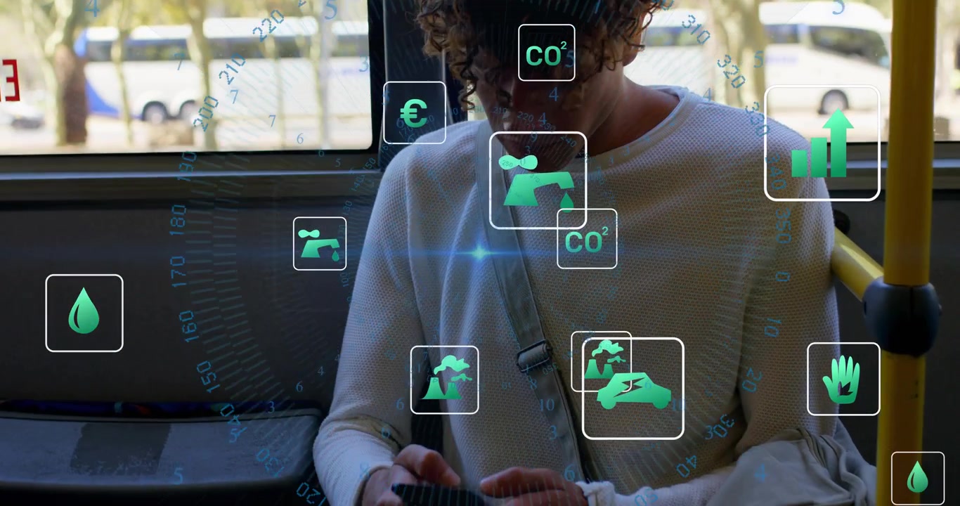 Holographic icons appearing, man sitting up and tapping smartphone on bus, wearing white top