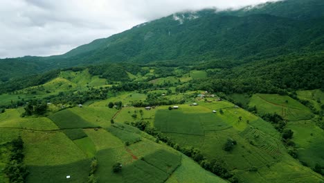 4K-Cinematic-nature-aerial-drone-footage-of-the-beautiful-mountains-and-rice-terraces-of-Ban-Pa-Pong-Piang-at-Doi-Ithanon-next-to-Chiang-Mai,-Thailand-on-a-cloudy-sunny-day