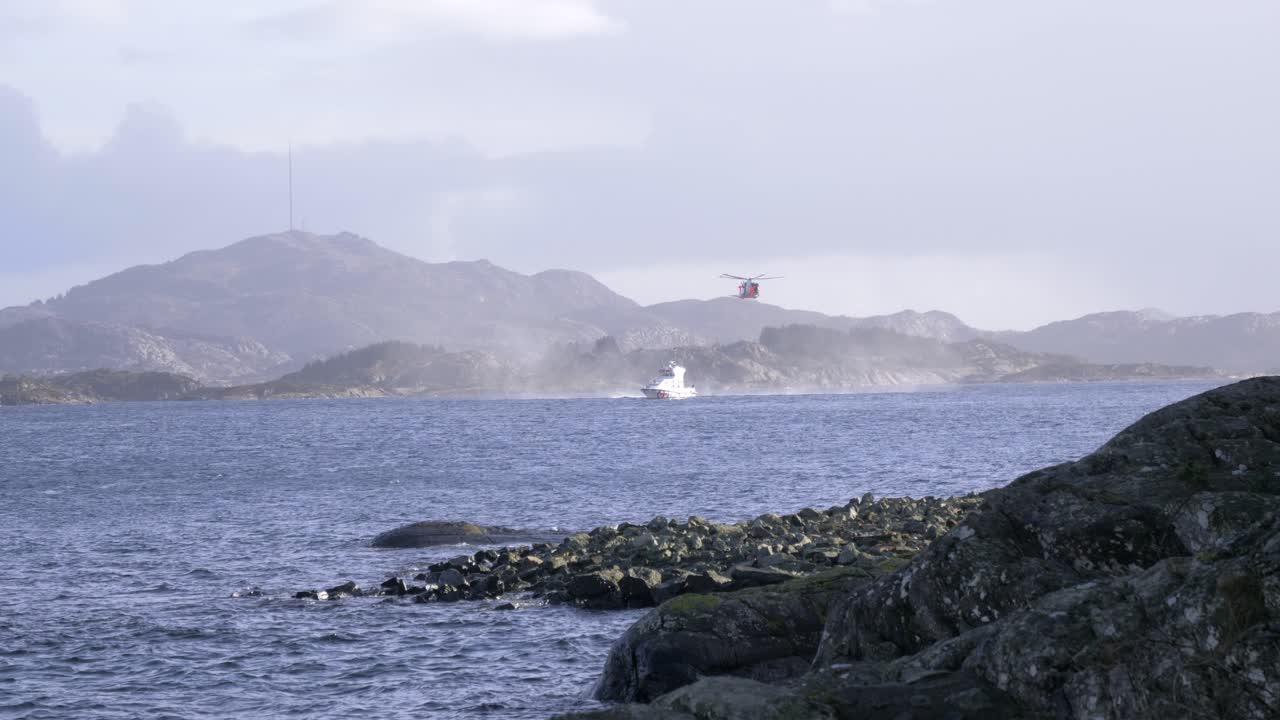 Coast Guard Helicopter and Boat Performing a Rescue Operation at Sea