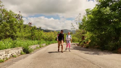 couple hiking on a mountain road