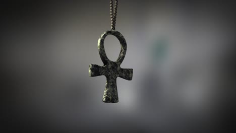 high quality close up render of a beautiful antique carved marble egyptian ankh artifact swinging slowly on the end of a neck chain, with super shallow depth of field abd bokeh background