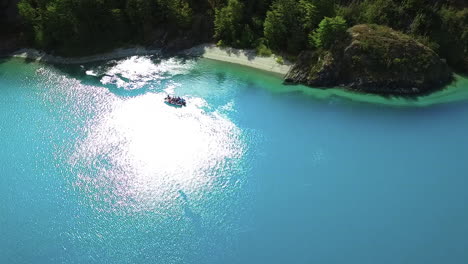 AERIAL---Tour-boat,-sunshine,-General-Carrera-Lake,-Patagonia,-Chile,-wide-shot