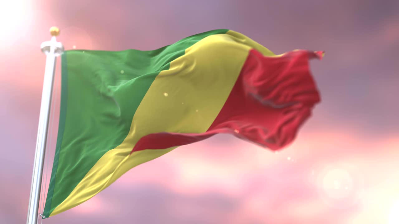 Flag of the Republic of the Congo waving at wind at sunset in slow, loop