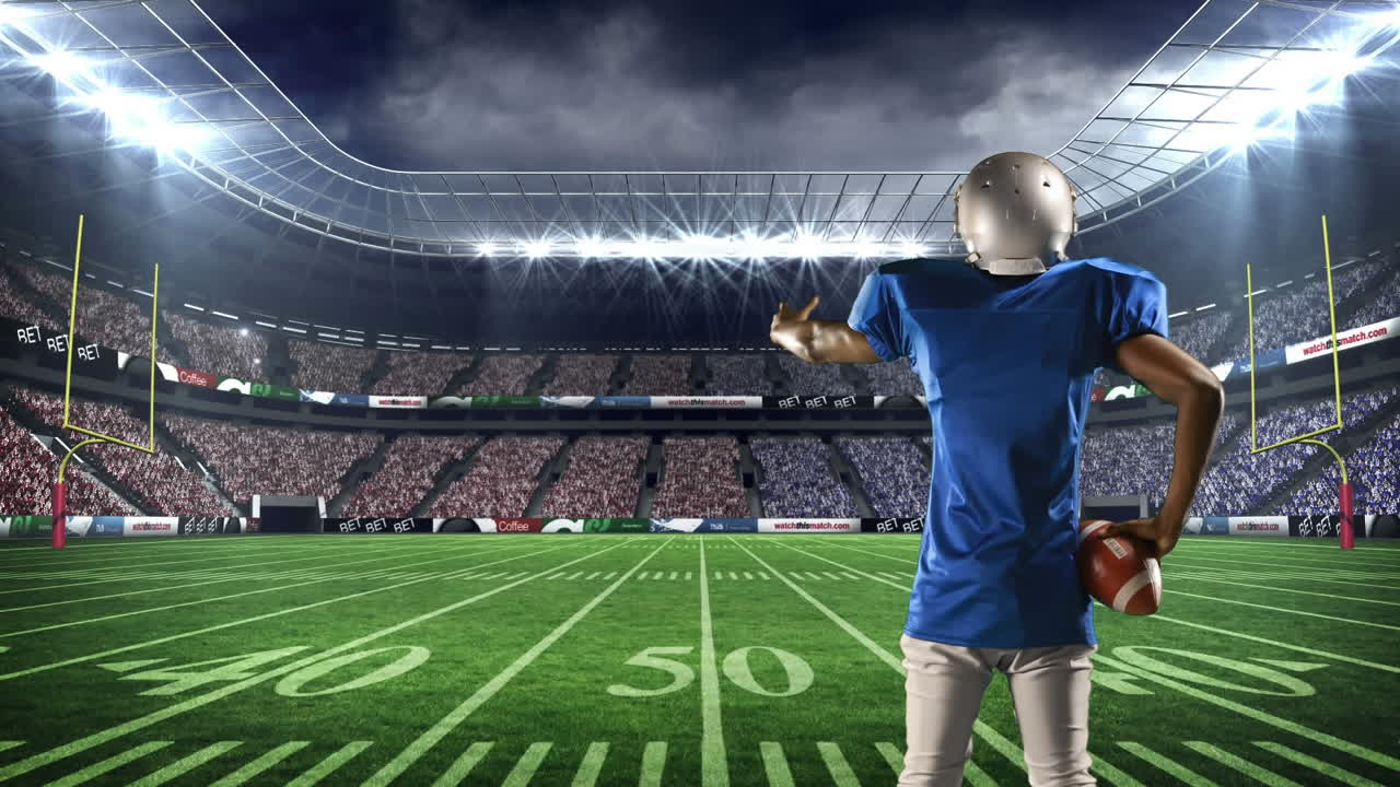 게임 필드에 서 있는 미국 축구 선수