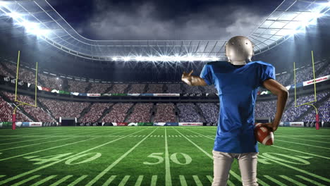american football player standing on the game field