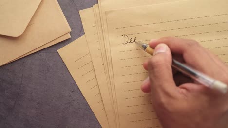 hand writing a letter