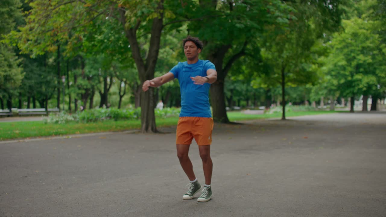 Man warming up in park