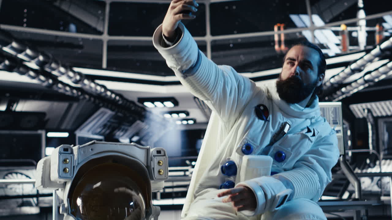 Astronaut taking selfie pictures with smartphone, making hand gestures