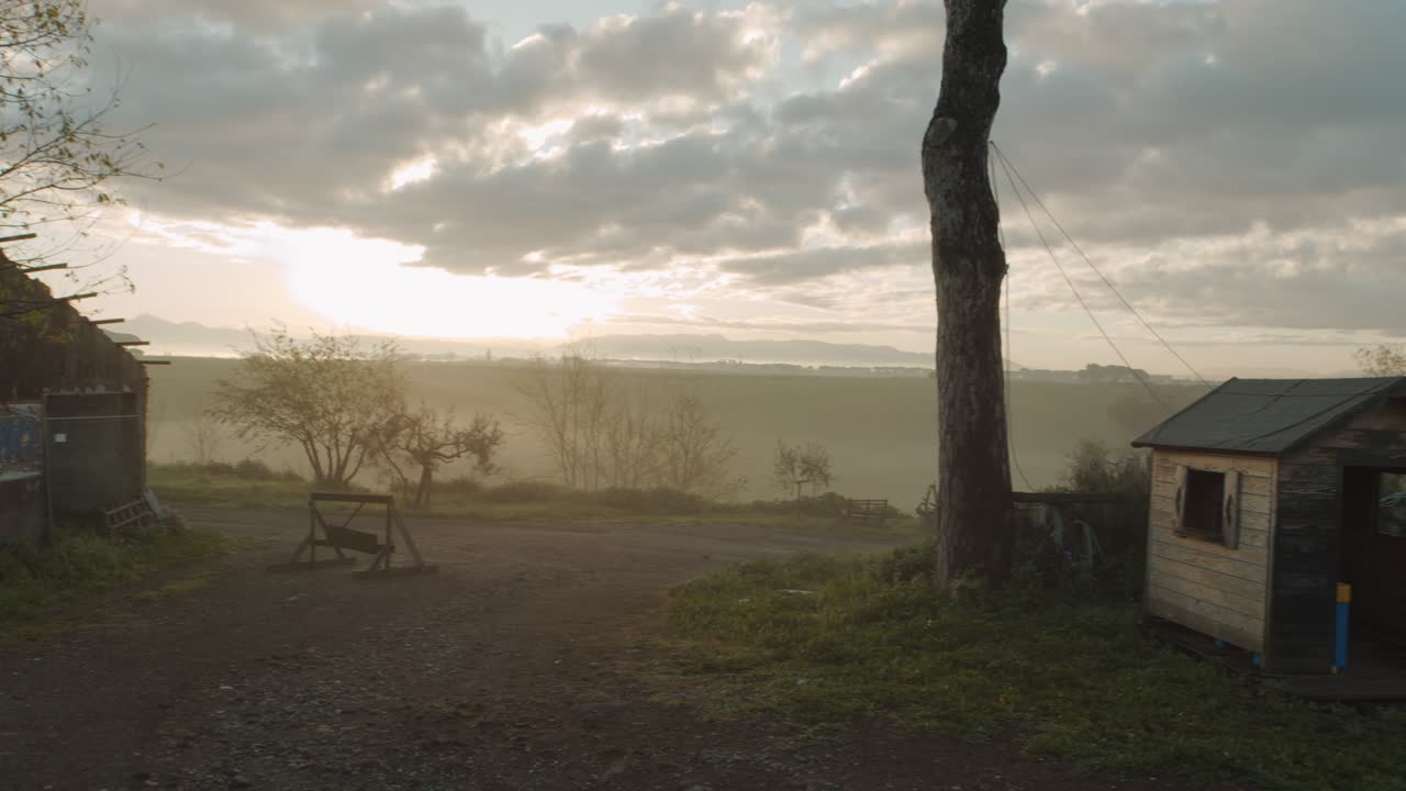 View of a dog bed in the countryside at sunrise