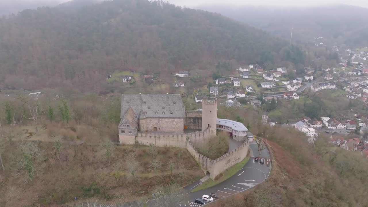 Drone orbit shot from Marburg Castle, also known as the Landgrave Castle of Marburg, is a medieval hilltop fortress overlooking the historic old town of Marburg, Germany