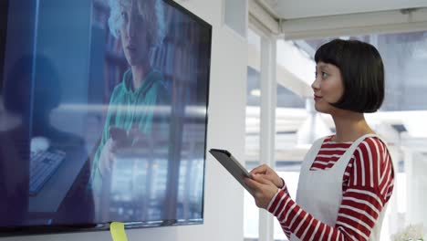 Young woman working in a creative office