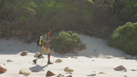 Sporty-mixed-race-man-with-prosthetic-leg-hiking