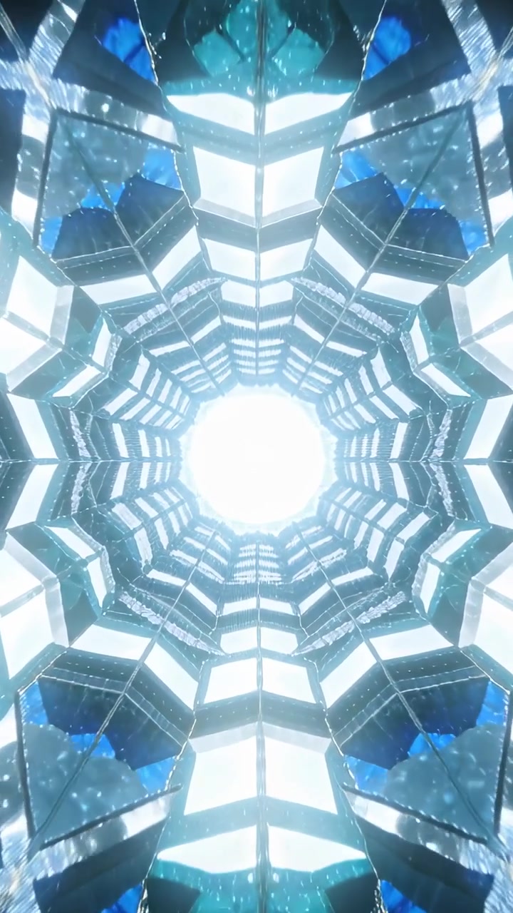 Video verticale: Tunnel esagonale sfaccettato centrale che si muove verso l'interno, illuminando il nucleo con scintille blu