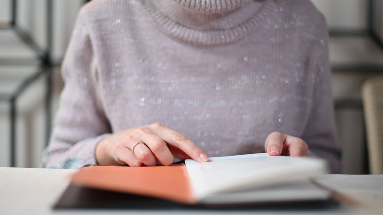 Woman reading a menu at a restaurant at lunch