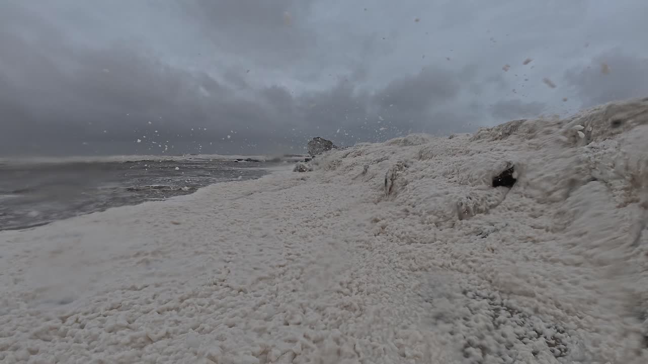 Beach Foam Blown By Strong Wind During Cyclone Alfred In Gold Coast, Queensland. static shot