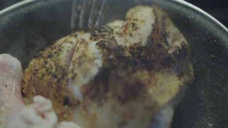 close up of roasted chicken in a pan