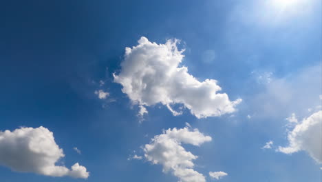 beautiful soft light clouds transforming in the bright rays of summer sun. low angle view timelapse.