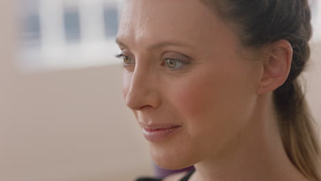 close up portrait beautiful caucasian woman smiling enjoying yoga class practicing healthy lifestyle in fitness studio