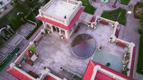 Aerial-orbit-family-walking-next-to-Falabella-Palace-with-stained-glass-ceiling-in-Providencia-Santiago-Chile