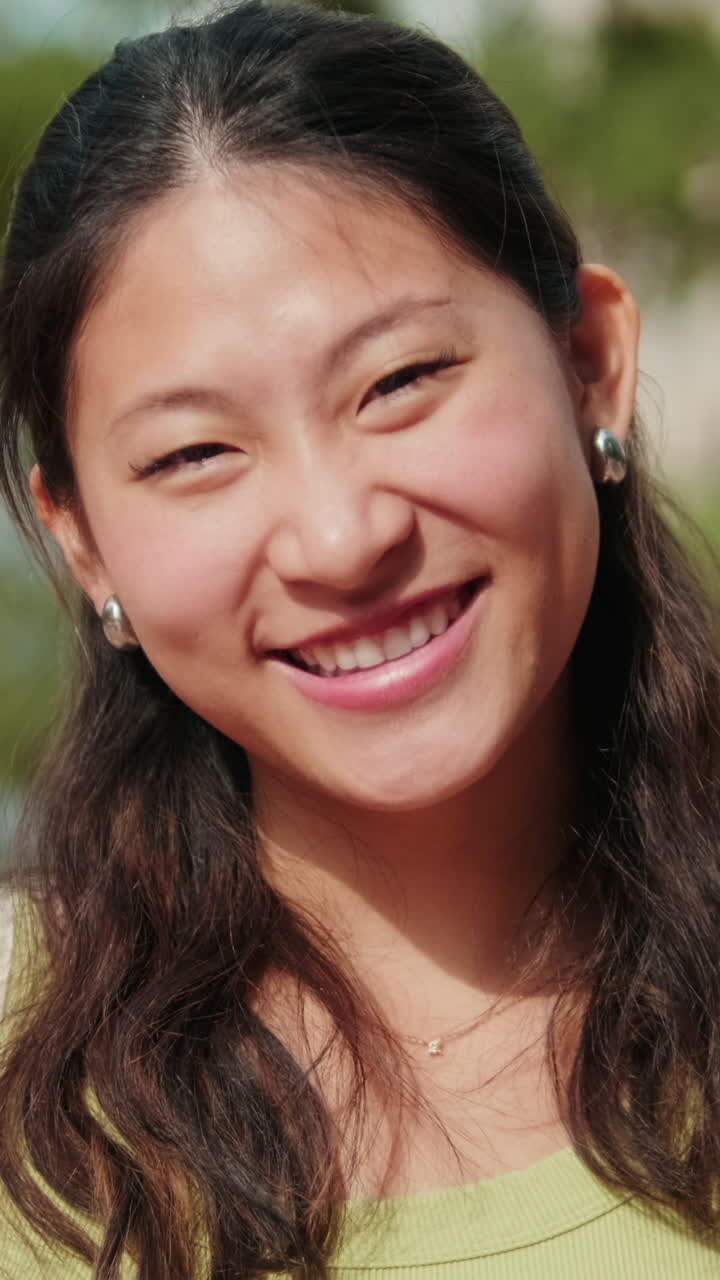 Asian girl with a notebooks, cute girl in the college standing outdoors and