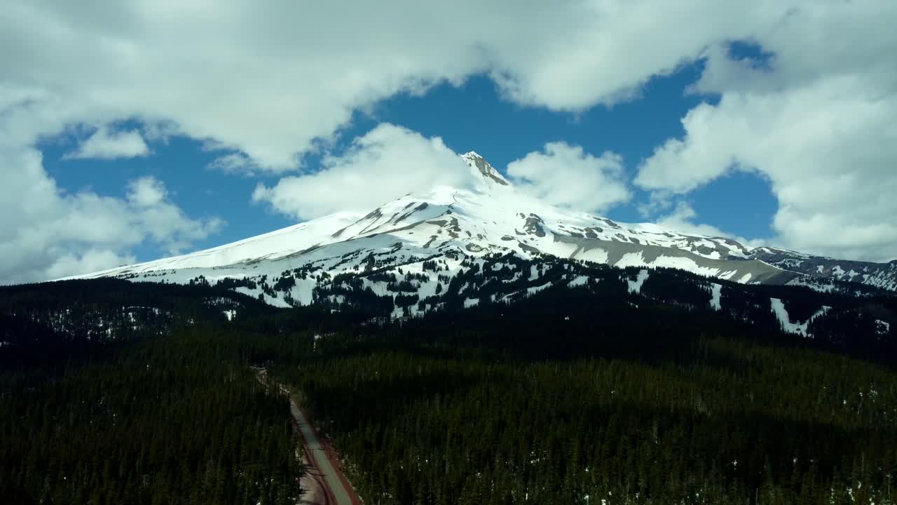 US, Oregon, Mt Hood, Bennett Pass, 2025-04-22 - Drone view of Mt Hood outside of Portland. On a spring day, with some clouds, viewed from the Southeast at Mt Hood Meadows