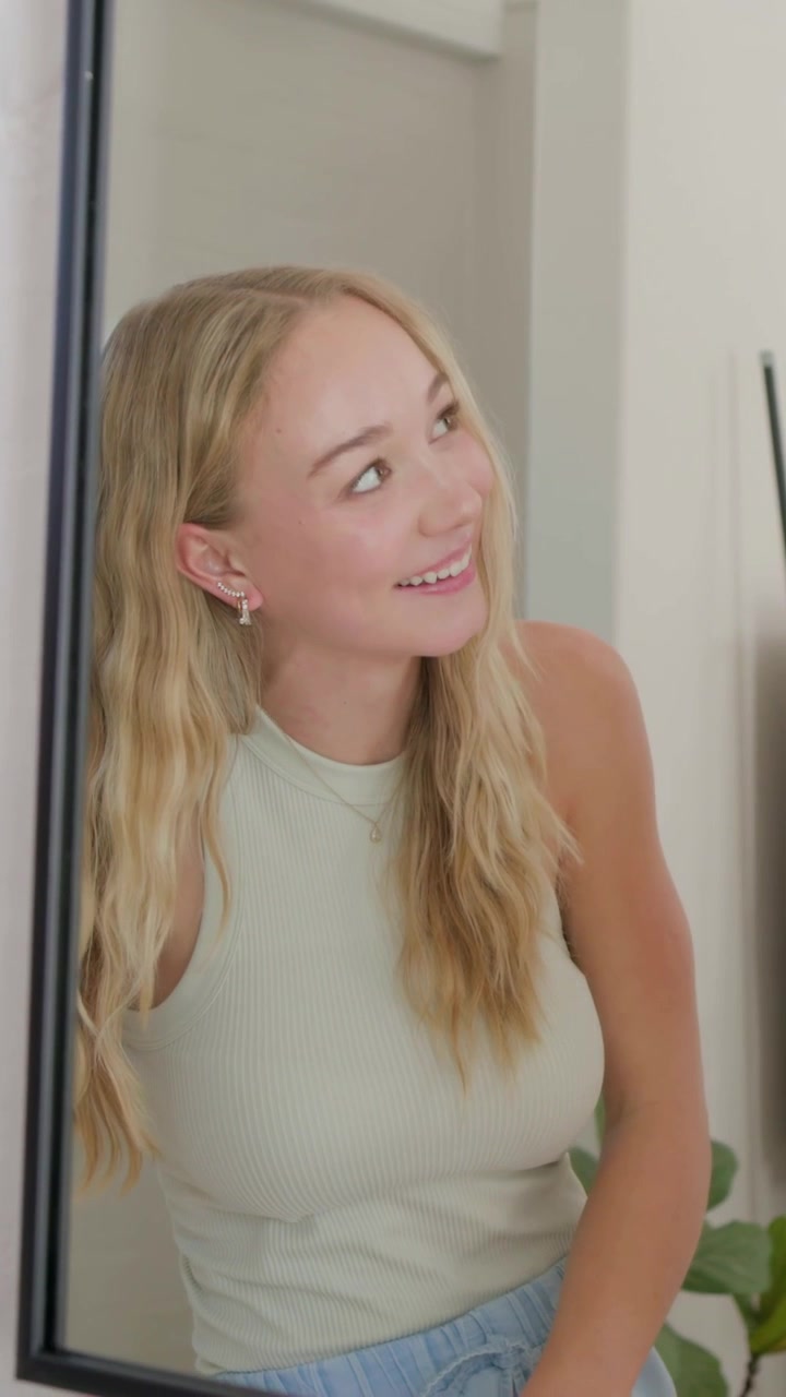 Vertical video: Watching woman smiling at vanity as man showing red under-eye patches for skincare