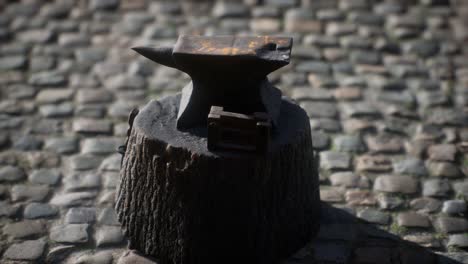 old anvil attached to a stump