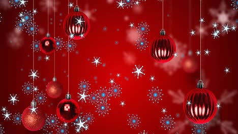 animación de bolas de navidad sobre copos de nieve sobre fondo rojo