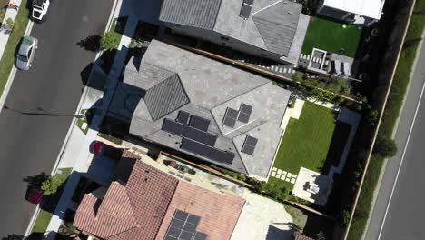 Aerial-orbit,-Tustin-solar-on-house,-renewable-energy