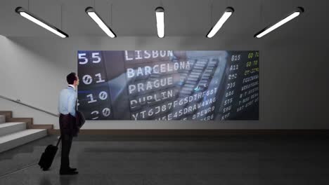 man with suitcase watching lcd