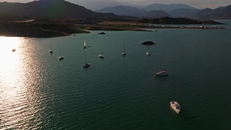 Slow-cinematic-shot-of-sailboats-floating-in-the-tropical-lake-in-Mendoza,-Argentina