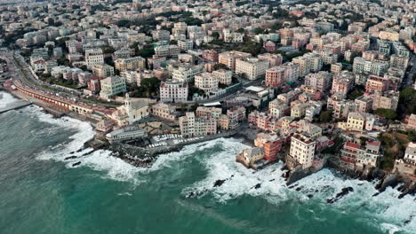 Aerial-view-of-Genoa-port-city-coastline-in-Liguria-region-lined-with-buildings