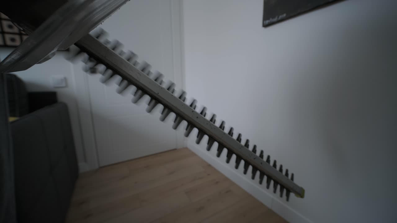 Close Up of Hedge Trimmer Blades Operating Indoors