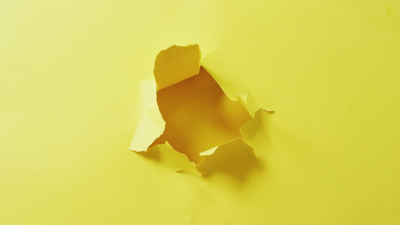 Video of close up of tron yellow paper on yellow background